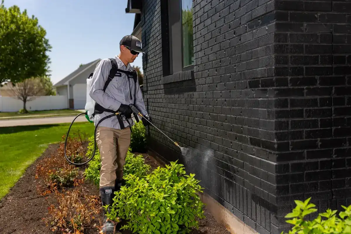 Technician Crew Spraying Exterior Pest Control 1